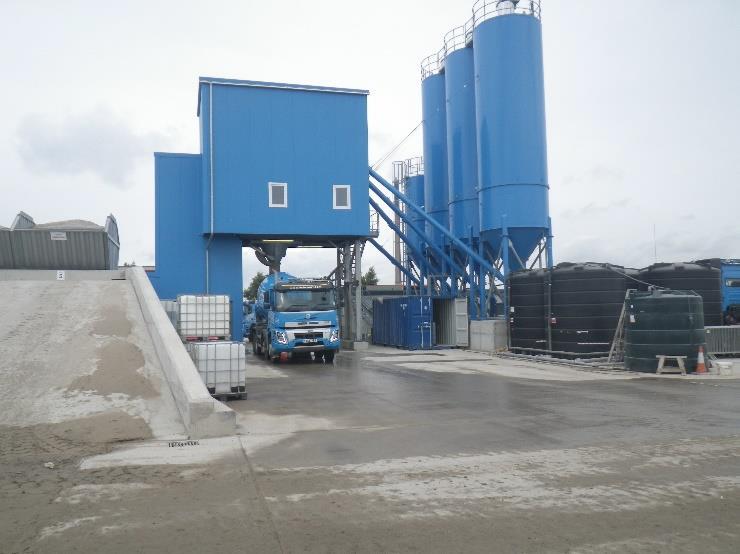 Blue lorry under blue loading terminal